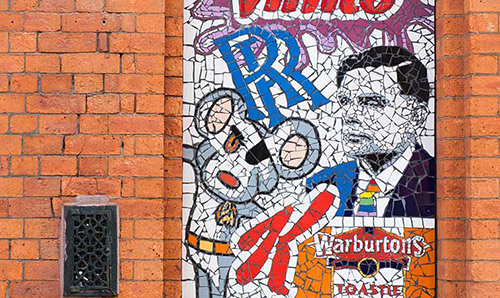 A mosaic of Manchester icons, including Alan Turing