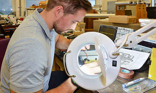 A researcher making a Geiger counter