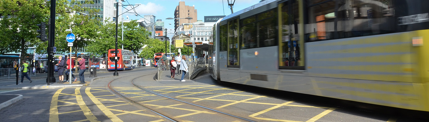 A moving tram in Manchester city centre