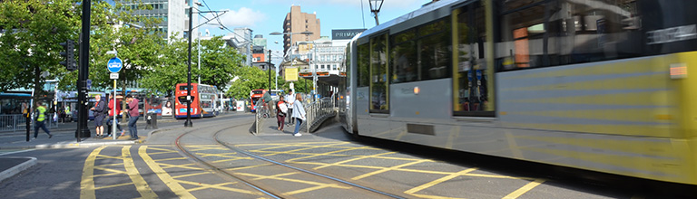 A moving tram in Manchester city centre