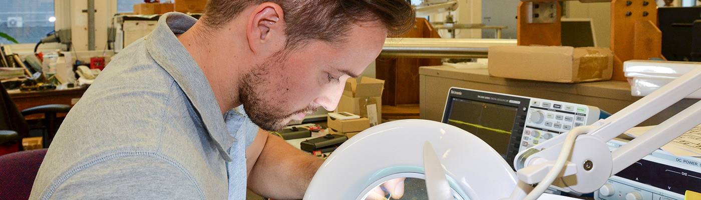 A researcher making a Geiger counter