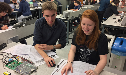 Female foundation year student being tutored by male undergraduate student